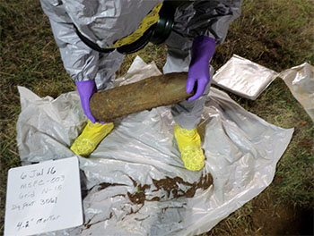 An operator recovers a 4.2” mortar during remediation operations. This type of mortar is the most common munition recovered at RSA.