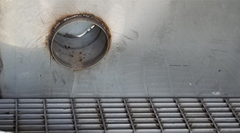 The IHF design includes a secondary containment area below the floor that would contain liquids in the event of a leak.