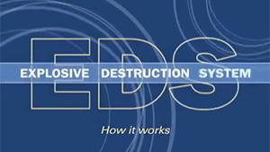 U.S. Army Chemical Materials Activity employees demonstrate how the explosives destruction system (EDS) works